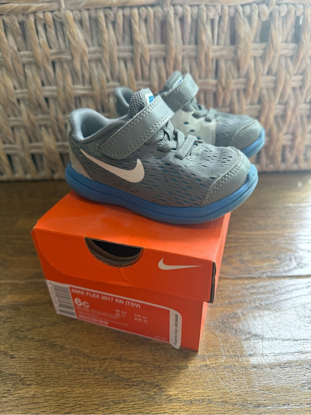 Nike Kids Gray Sneakers with Blue Soles and White Swoosh